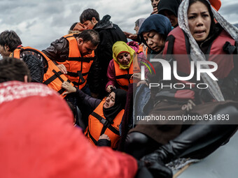  Migrants approach the coast of the northeastern Greek island of Lesbos on Thursday, Nov. 28, 2015. About 5,000 migrants are reaching Europe...