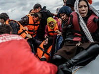  Migrants approach the coast of the northeastern Greek island of Lesbos on Thursday, Nov. 28, 2015. About 5,000 migrants are reaching Europe...