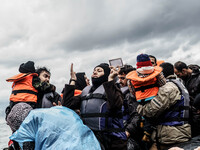  Migrants approach the coast of the northeastern Greek island of Lesbos on Thursday, Nov. 28, 2015. About 5,000 migrants are reaching Europe...