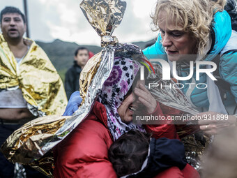  Migrants approach the coast of the northeastern Greek island of Lesbos on Thursday, Nov. 28, 2015. About 5,000 migrants are reaching Europe...