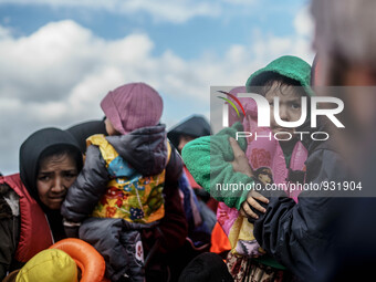  Migrants approach the coast of the northeastern Greek island of Lesbos on Thursday, Nov. 28, 2015. About 5,000 migrants are reaching Europe...