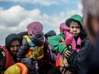  Migrants approach the coast of the northeastern Greek island of Lesbos on Thursday, Nov. 28, 2015. About 5,000 migrants are reaching Europe...