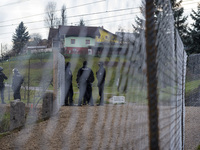 Police wait the arrival of migrants in Sentilj, Slovenia, on November 28, 2015. About 5,000 migrants are reaching Europe each day along the...
