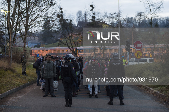 Migrants wait to be allowed to cross to Austria, in Sentilj, Slovenia. About 5,000 migrants are reaching Europe each day along the so-called...