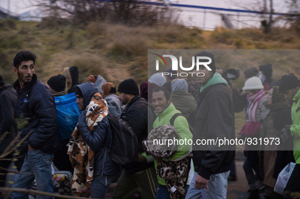 Migrants wait to be allowed to cross to Austria, in Sentilj, Slovenia. About 5,000 migrants are reaching Europe each day along the so-called...