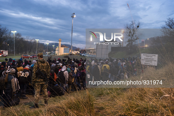 Migrants wait to be allowed to cross to Austria, in Sentilj, Slovenia. About 5,000 migrants are reaching Europe each day along the so-called...