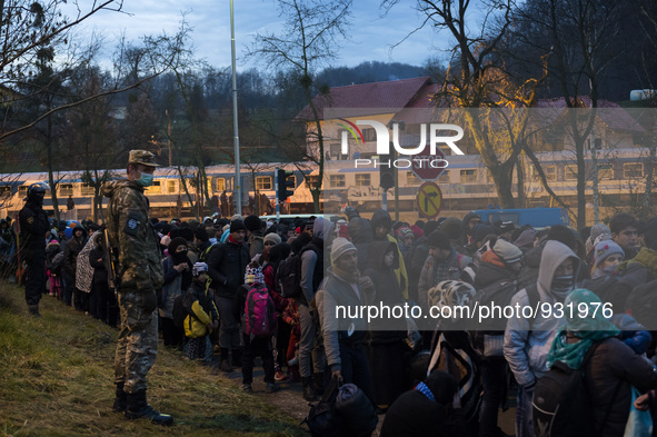 Migrants wait to be allowed to cross to Austria, in Sentilj, Slovenia. About 5,000 migrants are reaching Europe each day along the so-called...