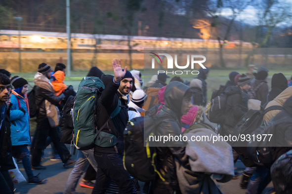 Migrants wait to be allowed to cross to Austria, in Sentilj, Slovenia. About 5,000 migrants are reaching Europe each day along the so-called...