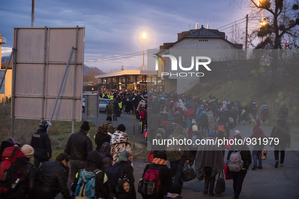 Migrants wait to be allowed to cross to Austria, in Sentilj, Slovenia. About 5,000 migrants are reaching Europe each day along the so-called...