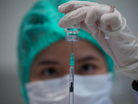 A doses of the COVID-19 vaccine is drawn from a vial at vaccination site inside the shopping mall in Bangkok on December 20, 2022 in Bangkok...