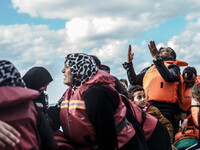  Migrants approach the coast of the northeastern Greek island of Lesbos on Thursday, Nov. 29, 2015. About 5,000 migrants are reaching Europe...