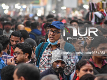 A man is seen improperly wearing a mask at a crowded place in Kolkata ,India , on 22 December 2022 . Indian health administration has issued...