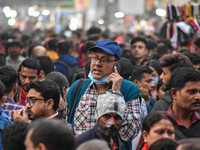 A man is seen improperly wearing a mask at a crowded place in Kolkata ,India , on 22 December 2022 . Indian health administration has issued...