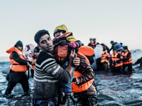 Migrants approach the coast of the northeastern Greek island of Lesbos on Thursday, Nov. 30, 2015. About 5,000 migrants are reaching Europe...