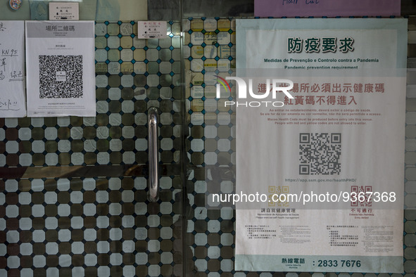 A poster for the Macau Health Code placed outside a store on December 29, 2022 in Macau, China. 