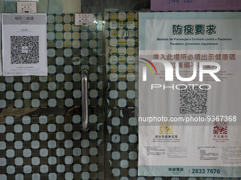 A poster for the Macau Health Code placed outside a store on December 29, 2022 in Macau, China. (