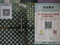 A poster for the Macau Health Code placed outside a store on December 29, 2022 in Macau, China. (