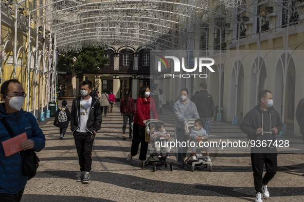 People wearing face mask walking in Senado Square on December 29, 2022 in Macau, China. 