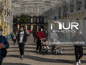 People wearing face mask walking in Senado Square on December 29, 2022 in Macau, China. (