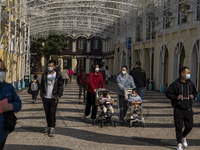 People wearing face mask walking in Senado Square on December 29, 2022 in Macau, China. (