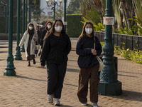 People wearing face masks walking in the street on December 29, 2022 in Macau, China. (