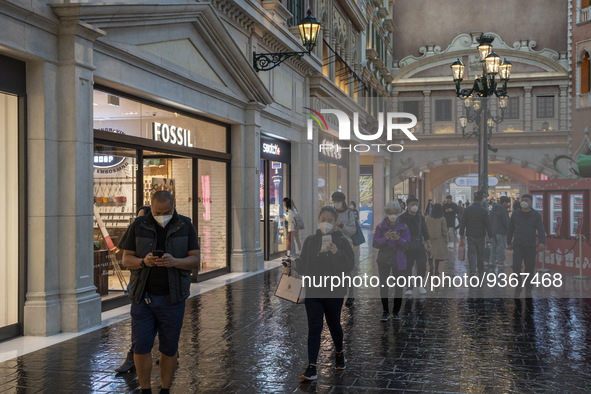 Shoppers wearing face masks inside The Grand Canal Shoppes on December 29, 2022 in Macau, China. 