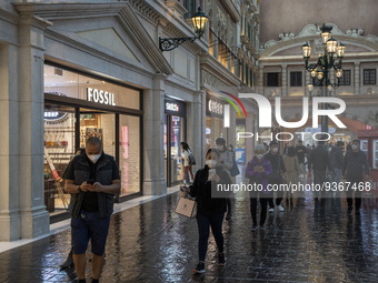 Shoppers wearing face masks inside The Grand Canal Shoppes on December 29, 2022 in Macau, China. (