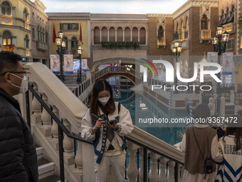 People wearing face mask inside The Grand Canal Shoppes on December 29, 2022 in Macau, China. (