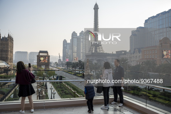 People looking at the Hotels, Resorts and Casinos on the Cotai Strip on December 29, 2022 in Macau, China. 