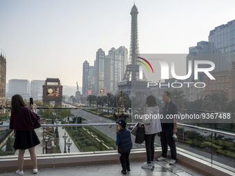 People looking at the Hotels, Resorts and Casinos on the Cotai Strip on December 29, 2022 in Macau, China. (