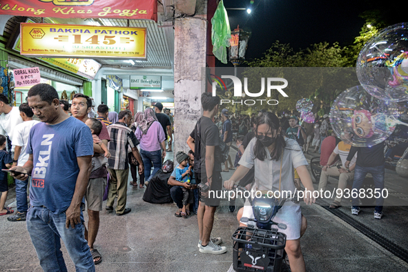 People gather at Malioboro Street during holiday for the end of the year in Yogyakarta, Indonesia on December 30, 2022, as Indonesian Presid...