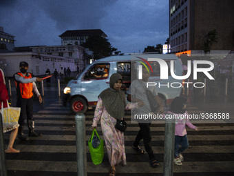 Peoples crossing the road as they visiting the Kota Tua Jakarta (Jakarta Old Town) tourism area during the holiday season, in Jakarta on Dec...