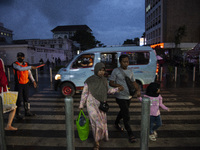 Peoples crossing the road as they visiting the Kota Tua Jakarta (Jakarta Old Town) tourism area during the holiday season, in Jakarta on Dec...