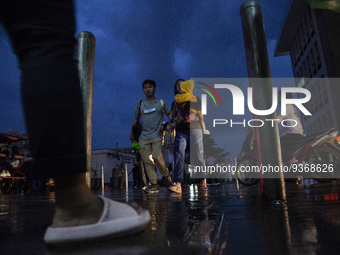 Peoples crossing the road as they visiting the Kota Tua Jakarta (Jakarta Old Town) tourism area during the holiday season, in Jakarta on Dec...