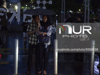 Peoples enjoy a vacation at the Kota Tua tourism area, in Jakarta on December 30, 2022. President Joko Widodo, officially announced the lift...