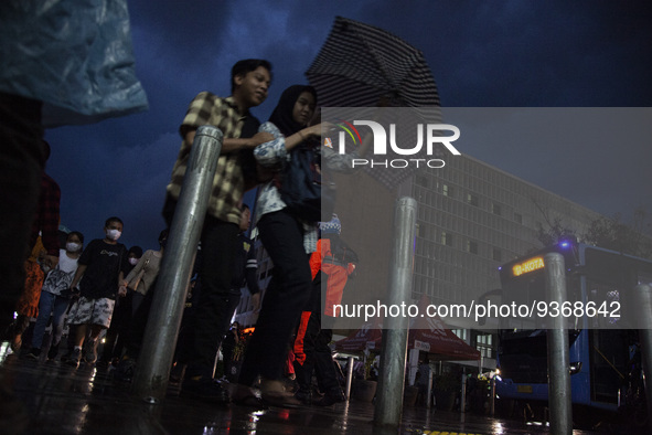 Peoples crossing the road as they visiting the Kota Tua Jakarta (Jakarta Old Town) tourism area during the holiday season, in Jakarta on Dec...