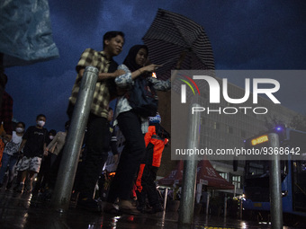 Peoples crossing the road as they visiting the Kota Tua Jakarta (Jakarta Old Town) tourism area during the holiday season, in Jakarta on Dec...