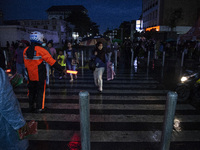 Peoples crossing the road as they visiting the Kota Tua Jakarta (Jakarta Old Town) tourism area during the holiday season, in Jakarta on Dec...