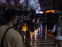 Peoples crossing the road as they visiting the Kota Tua Jakarta (Jakarta Old Town) tourism area during the holiday season, in Jakarta on Dec...