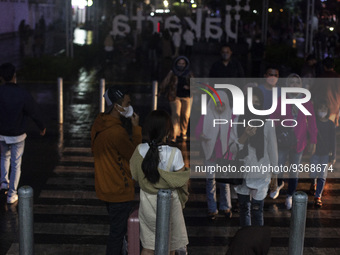 Peoples crossing the road as they visiting the Kota Tua Jakarta (Jakarta Old Town) tourism area during the holiday season, in Jakarta on Dec...