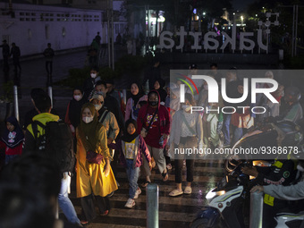 Peoples crossing the road as they visiting the Kota Tua Jakarta (Jakarta Old Town) tourism area during the holiday season, in Jakarta on Dec...