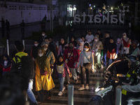 Peoples crossing the road as they visiting the Kota Tua Jakarta (Jakarta Old Town) tourism area during the holiday season, in Jakarta on Dec...