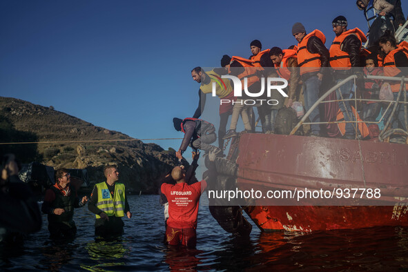 Migrants approach the coast of the northeastern Greek island of Lesbos on Thursday, Dec. 1, 2015. About 5,000 migrants are reaching Europe e...