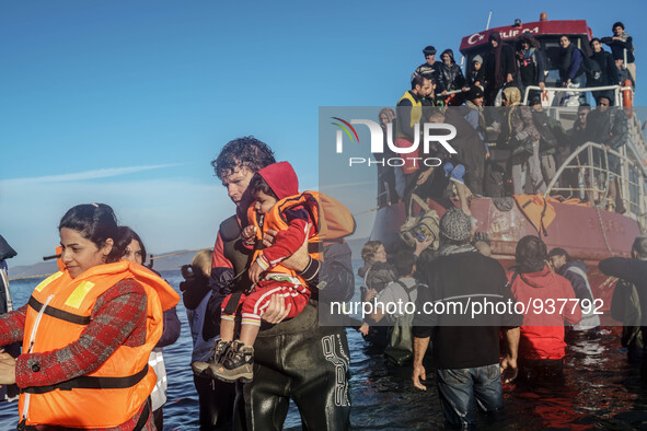 Migrants approach the coast of the northeastern Greek island of Lesbos on Thursday, Dec. 1, 2015. About 5,000 migrants are reaching Europe e...