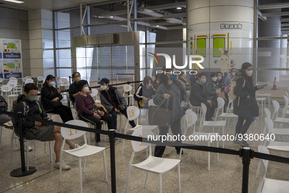 People at a waiting area in a Covid-19 vaccination station inside an MTR Station on January 2, 2023 in Hong Kong, China. 