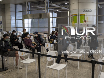 People at a waiting area in a Covid-19 vaccination station inside an MTR Station on January 2, 2023 in Hong Kong, China. (