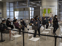 People at a waiting area in a Covid-19 vaccination station inside an MTR Station on January 2, 2023 in Hong Kong, China. (