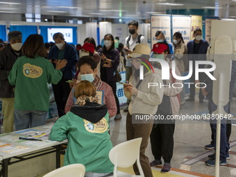 People lining up at a Covid-19 vaccination station inside an MTR Station on January 2, 2023 in Hong Kong, China. (