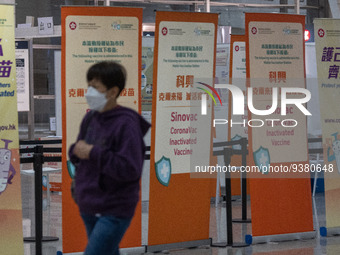 A women walks pass signs for the Sinovac CoronaVac Inactivated Vaccine by China Biotechnology company, Sinovac Biotech Ltd.,at a Covid-19 va...