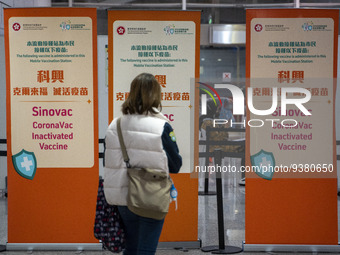 A women looks at signs for the Sinovac CoronaVac Inactivated Vaccine by China Biotechnology company, Sinovac Biotech Ltd.,at a Covid-19 vacc...